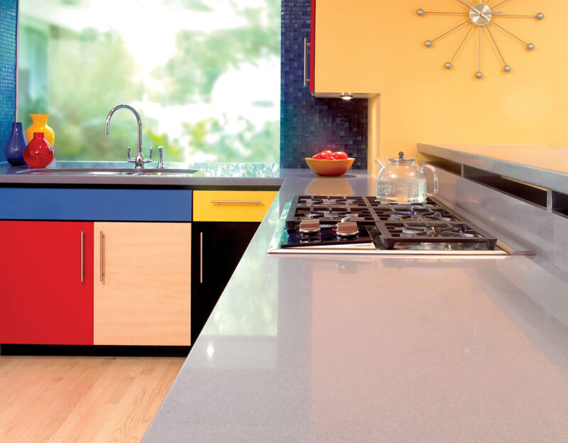 grey quartz countertop in colorful kitchen