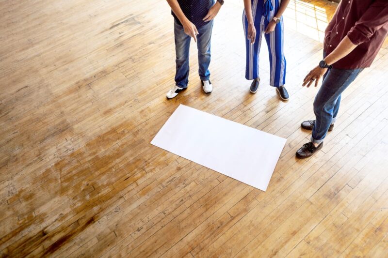 People Standing On Commercial Laminate Flooring